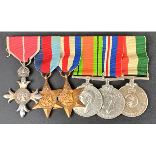 251 - A group of six medals, awarded to 199411 Fg Offr P H Hudgell RAF, comprising an MBE, 1939-1945 Star,... 