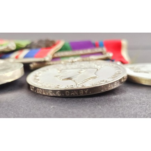 252 - A group of eight medals, awarded to Lt Col C C Danby Royal Signals, comprising an OBE, a 1939-1945 S... 