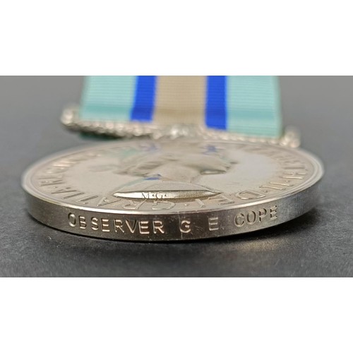 264 - An Observer Corp medal, awarded to Observer G E Cope, boxed, with a cloth shoulder title and copy do... 