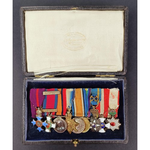 275 - A group of nine miniature medals, including a DSO, in a boxProvenance: On Instructions of the Family... 