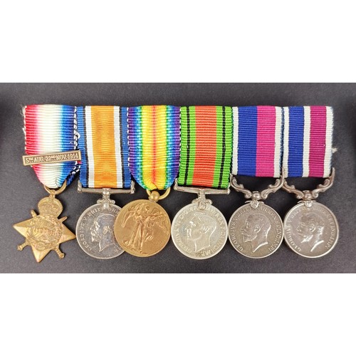 277 - A group of seven miniature medals, including a Distinguished Service Cross (DSC), and other assorted... 