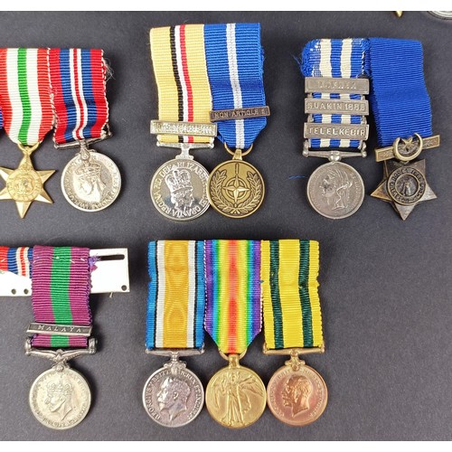 277 - A group of seven miniature medals, including a Distinguished Service Cross (DSC), and other assorted... 