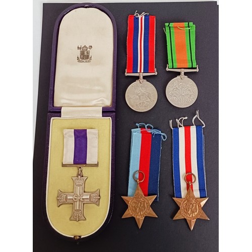 293 - A group of five medals, awarded to Lt W Flint 61st Recce Rgt RAC, comprising a Military Cross (MC), ... 