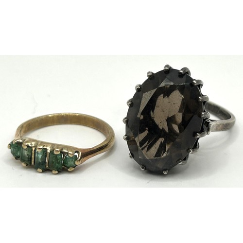 1753 - A 9ct gold and green stone ring, ring size J, and a brown stone dress ring, ring size N (2)