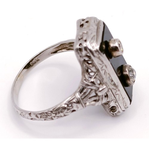 1734 - An Art Deco white gold, onyx and diamond ring, ring size N