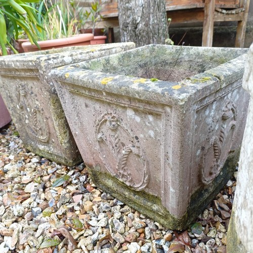 1434 - A pair of composite stone planters, decorated thistles