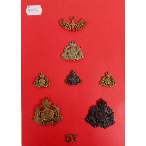 431 - A group of assorted military badges, including HAC, XII Royal Lancers, Derbyshire Yeomanry and other... 