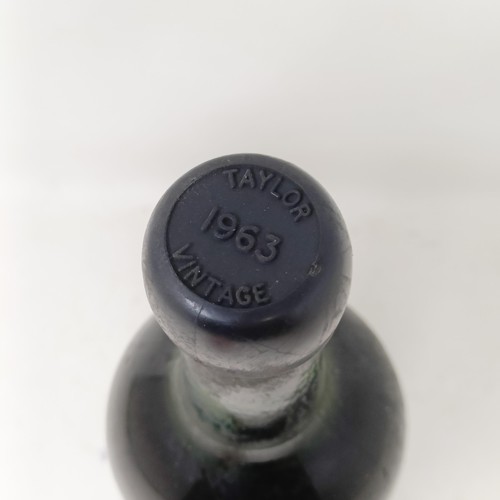 2166 - A bottle of 1963 vintage port, TaylorsProvenance: From a West Country House, stored in a temperature... 