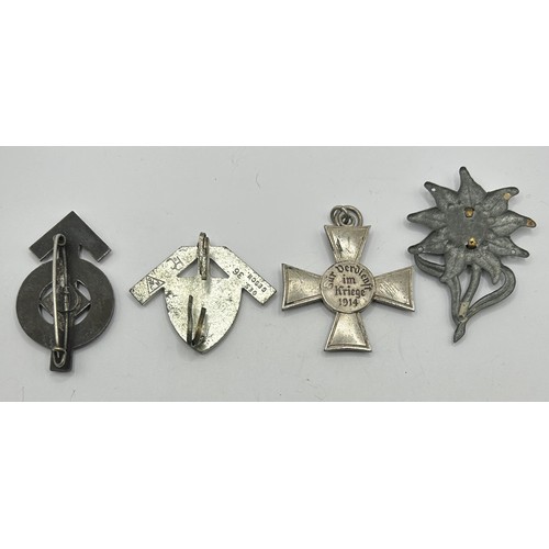 536 - A Hitler Youth Proficiency badge, a German Workers cap badge, a German World War I Hanseatic Cross a... 