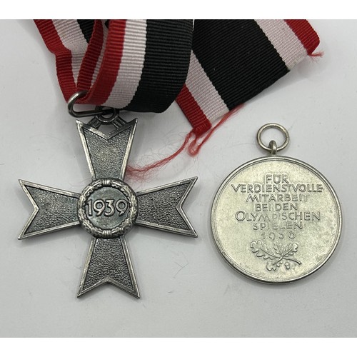 537 - A German Olympic medal, 1936, and a German Medal of the War Merit Cross (2) Provenance: On Instructi... 