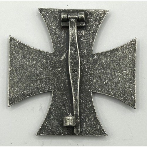 546 - A German World War II Iron Cross, 1st Class, numbered 65 on the pin Provenance: On Instructions of t... 