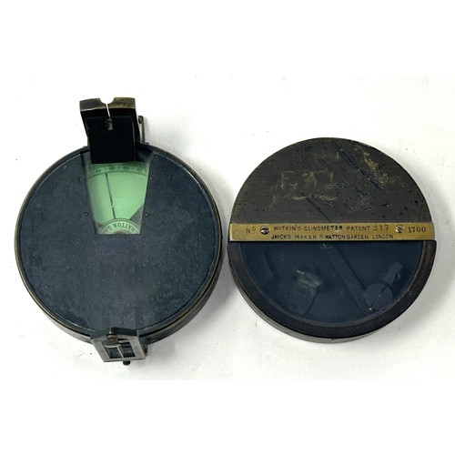 407 - A Watkin's clinometer, with a compass, in a leather case, some damage to the case, an inert Mills gr... 