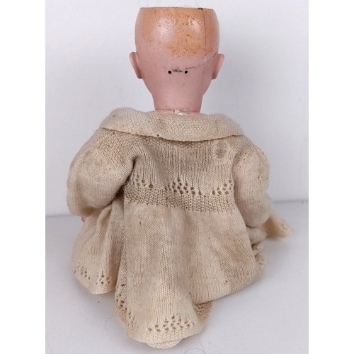 900 - An Armand Marseille bisque head doll, with a jointed body, and glass millefiori eyes, No 390, 74 cm ... 