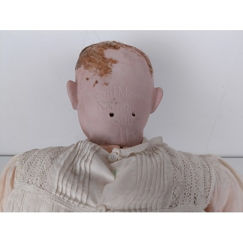 900 - An Armand Marseille bisque head doll, with a jointed body, and glass millefiori eyes, No 390, 74 cm ... 