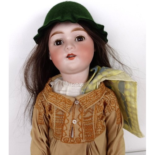 904 - A German Mignon bisque head doll, with a jointed body with millefiori glass eyes, No 3, 60 cm high P... 