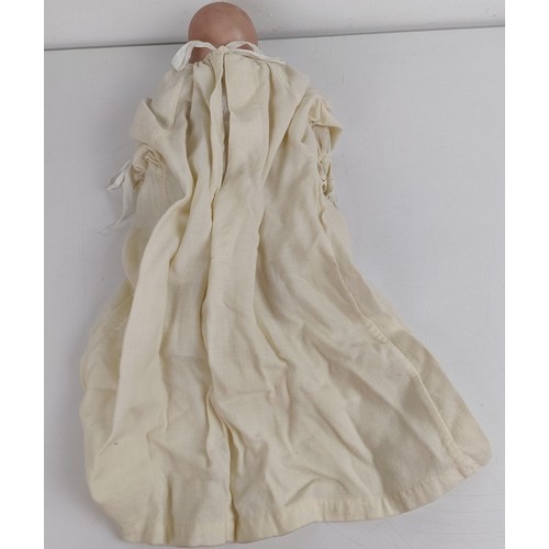 911 - A German bisque head baby doll, 36 cm high, with a cloth and composite body, 30 cm and another (2) <...