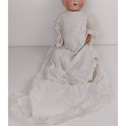 912 - An Armand Marseille bisque head baby doll, with a composite and cloth body, 42 cm, and another (2) P... 