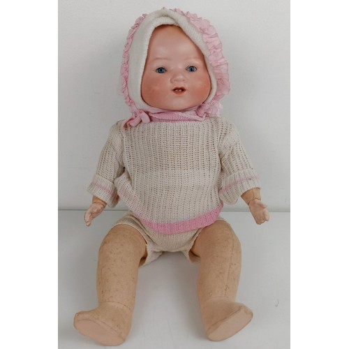 912 - An Armand Marseille bisque head baby doll, with a composite and cloth body, 42 cm, and another (2) P... 