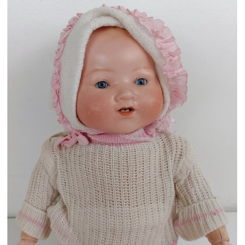 912 - An Armand Marseille bisque head baby doll, with a composite and cloth body, 42 cm, and another (2) P... 