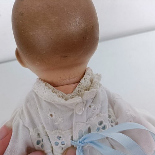 913 - An Armand Marseille bisque head baby doll, with a composite body, 31 cm, and another, 26 cm (2) Prov... 