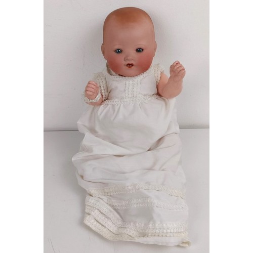 915 - A German Armand Marseille baby doll, 30 cm and two other baby dolls (3) Provenance:  From a lar... 