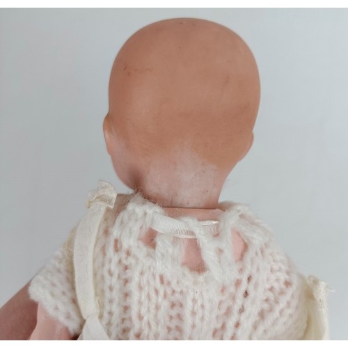 915 - A German Armand Marseille baby doll, 30 cm and two other baby dolls (3) Provenance:  From a lar... 