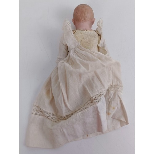 921 - A German bisque head doll, with a leather jointed body, 23 cm Provenance:  From a large single ... 