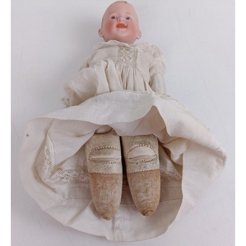 921 - A German bisque head doll, with a leather jointed body, 23 cm Provenance:  From a large single ... 