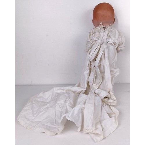 923 - A German Armand Marseille baby doll, with a cloth body, 40 cm, and two other dolls (3) Provenance:&n... 