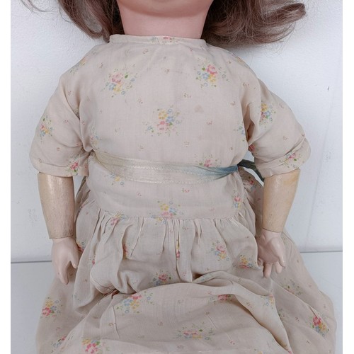 925 - A German Herm Steiner bisque head doll, No 20, with a composite body and millefiori glass eyes, 70 c...