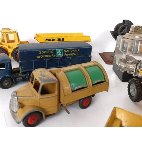 990 - Assorted play worn toy dumper trucks and other trucks, and a Dinky Supertoys box only, No 959