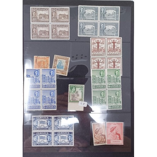 693 - A group of Jamaica stamps, early mint and used with mint sets and blocks