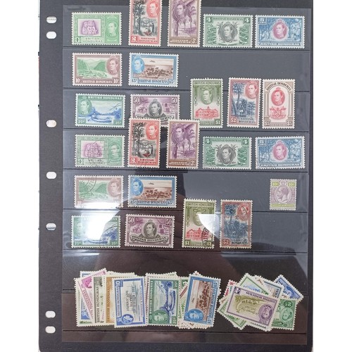 653 - A group of British Honduras mint sets and used stamps