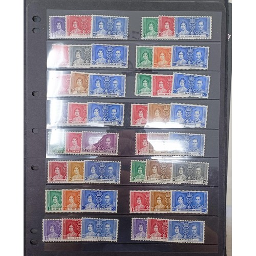 635 - A group of Coronation and Victory mint sets