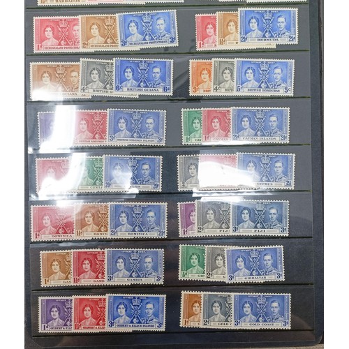 635 - A group of Coronation and Victory mint sets