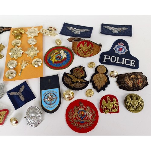 586 - Assorted bullion and other military badges, medal ribbons and items