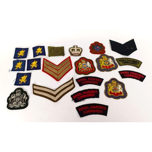 583 - Assorted militaria including cloth rank badges, Wessex Brigade cloth badges, Canadian rank badges an... 