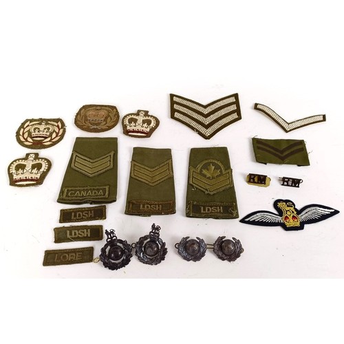 583 - Assorted militaria including cloth rank badges, Wessex Brigade cloth badges, Canadian rank badges an... 