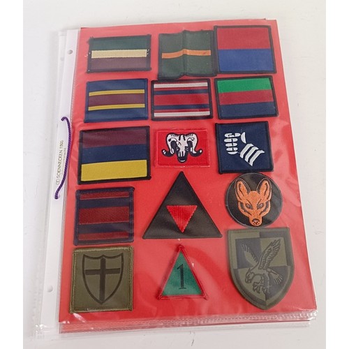 583 - Assorted militaria including cloth rank badges, Wessex Brigade cloth badges, Canadian rank badges an... 