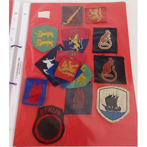 583 - Assorted militaria including cloth rank badges, Wessex Brigade cloth badges, Canadian rank badges an... 