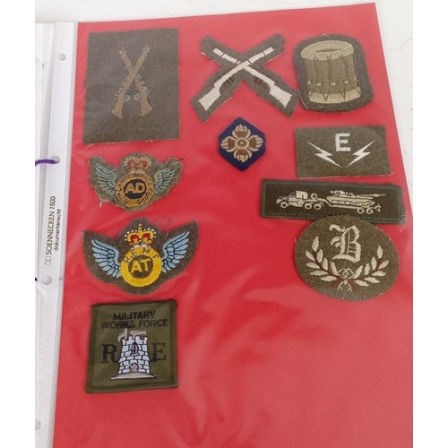 583 - Assorted militaria including cloth rank badges, Wessex Brigade cloth badges, Canadian rank badges an... 