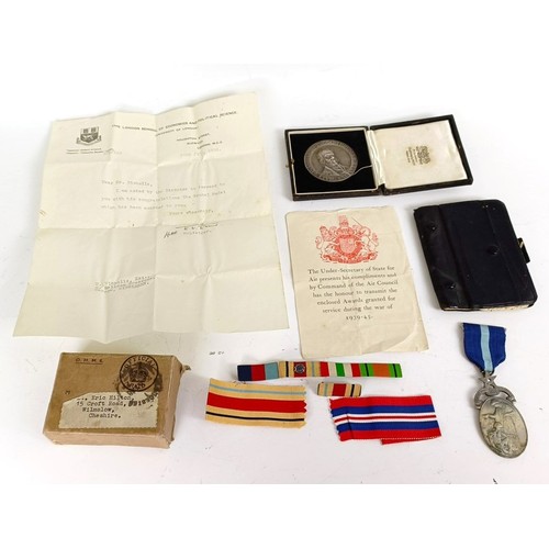 580 - A group of four medals, awarded to Flight Lieutenant Eric Hilton, comprising a 1939-1945 Star, Afric... 