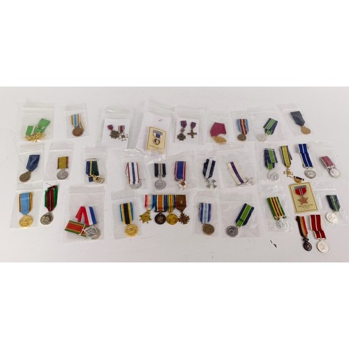 578 - A collection of miniature medals, WWI onwards, and including USA, NASA, Malawi, Silver Jubilee, Jama... 