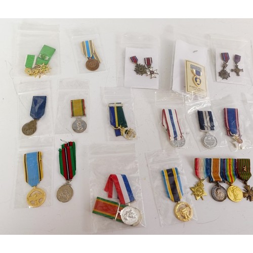 578 - A collection of miniature medals, WWI onwards, and including USA, NASA, Malawi, Silver Jubilee, Jama... 