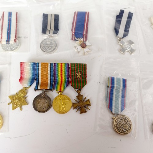 578 - A collection of miniature medals, WWI onwards, and including USA, NASA, Malawi, Silver Jubilee, Jama... 