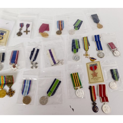 578 - A collection of miniature medals, WWI onwards, and including USA, NASA, Malawi, Silver Jubilee, Jama... 