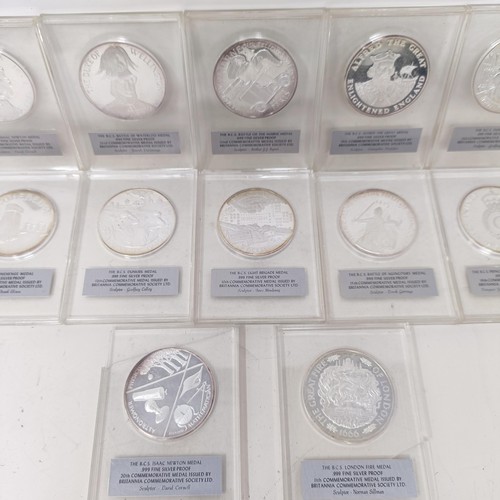 343 - A set of twelve silver proof 1 ozt commemorative medallions, in plastic capsules...