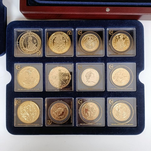 352 - A set of London Mint medallions, The Millionaires Collection, cased, with a file of information...