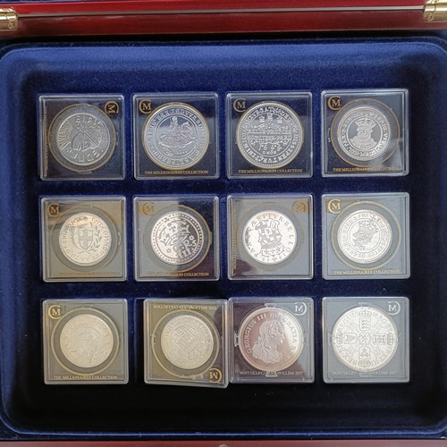 352 - A set of London Mint medallions, The Millionaires Collection, cased, with a file of information...