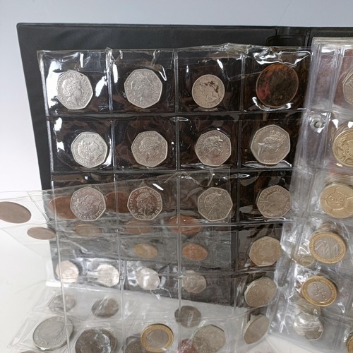 353 - A group of assorted modern commemorative £2, £1, 50p, other coins and crowns, in an albu...